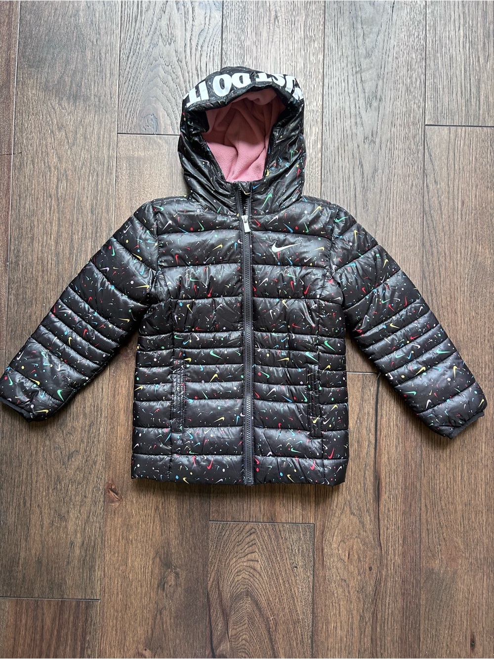 Nike Kids Black Puffer Jacket with Pink Lining and Multicolor Checks